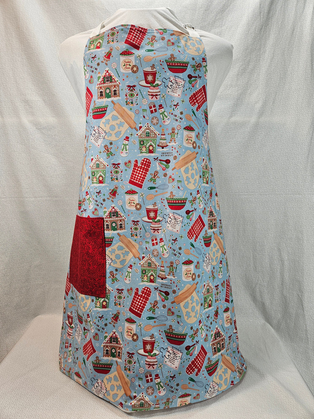 Apron with Christmas cookie pattern on a blue background